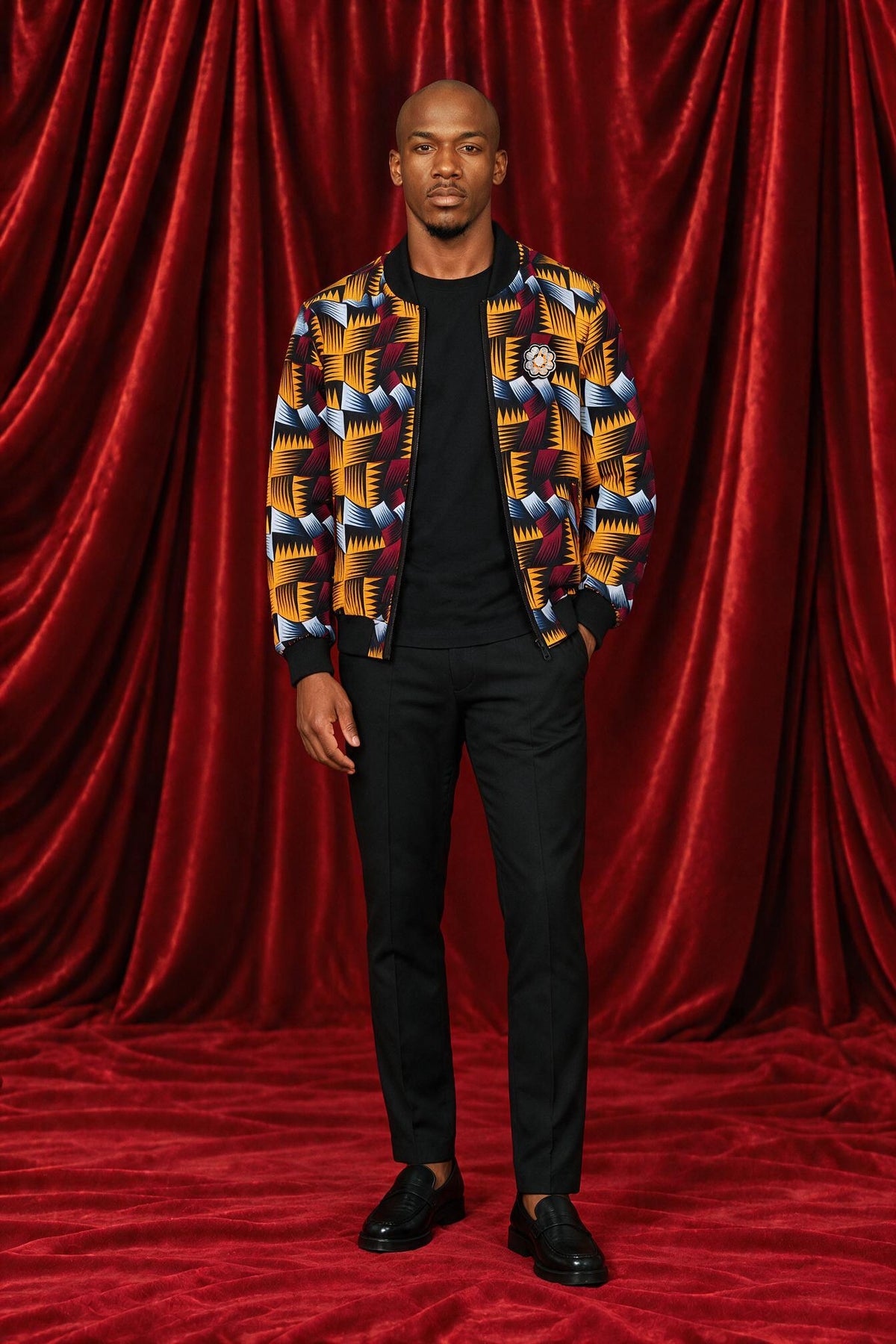 Mike wearing the Nala print bomber jacket, front view.
