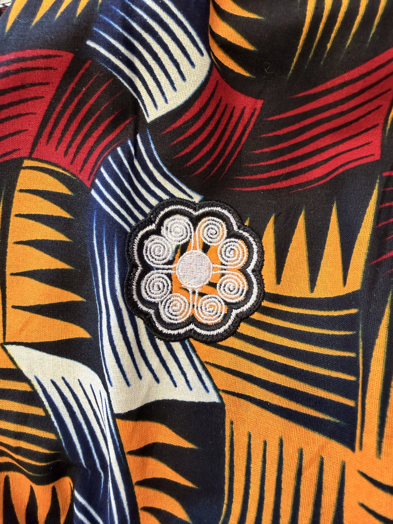 Original photograph of the white embroidered Chepa emblem on Nala's Ankara fabric.