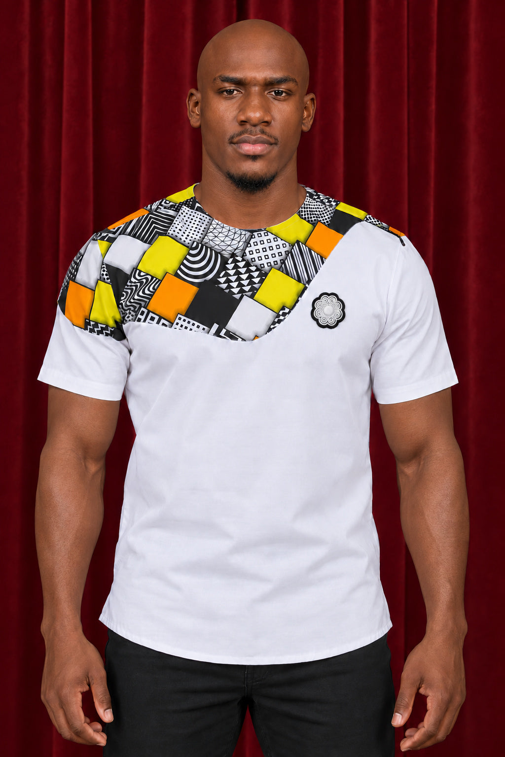 Front view of the Chepa Lwazi Yoke Tee in white with a patchwork print yoke and the white Chepa emblem